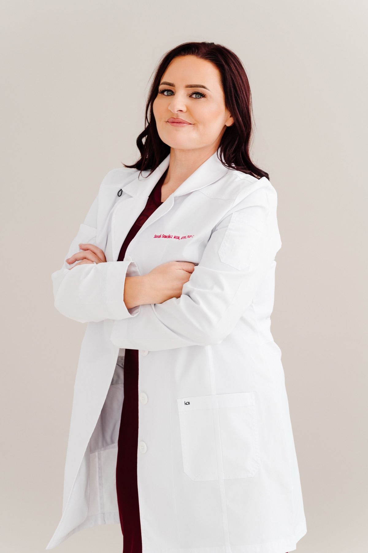 Sarah Sanchez, FNP-C, in her white coat