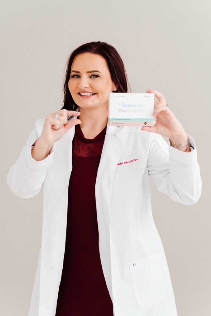 Sarah Sanchez holding a hormone therapy product