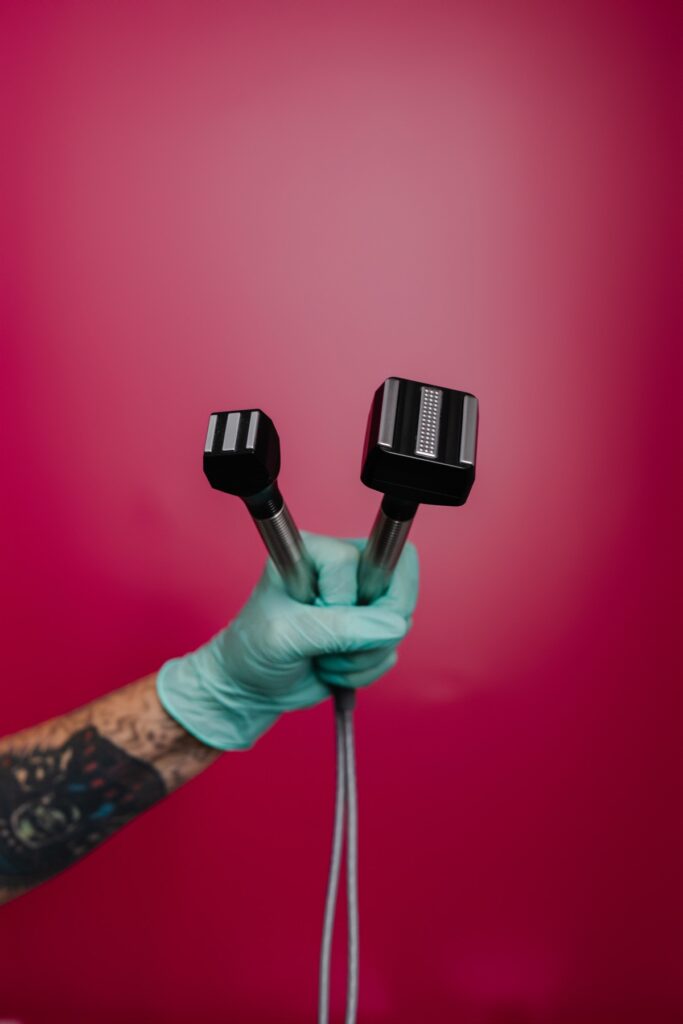 Forma radiofrequency handpieces against a pink wall