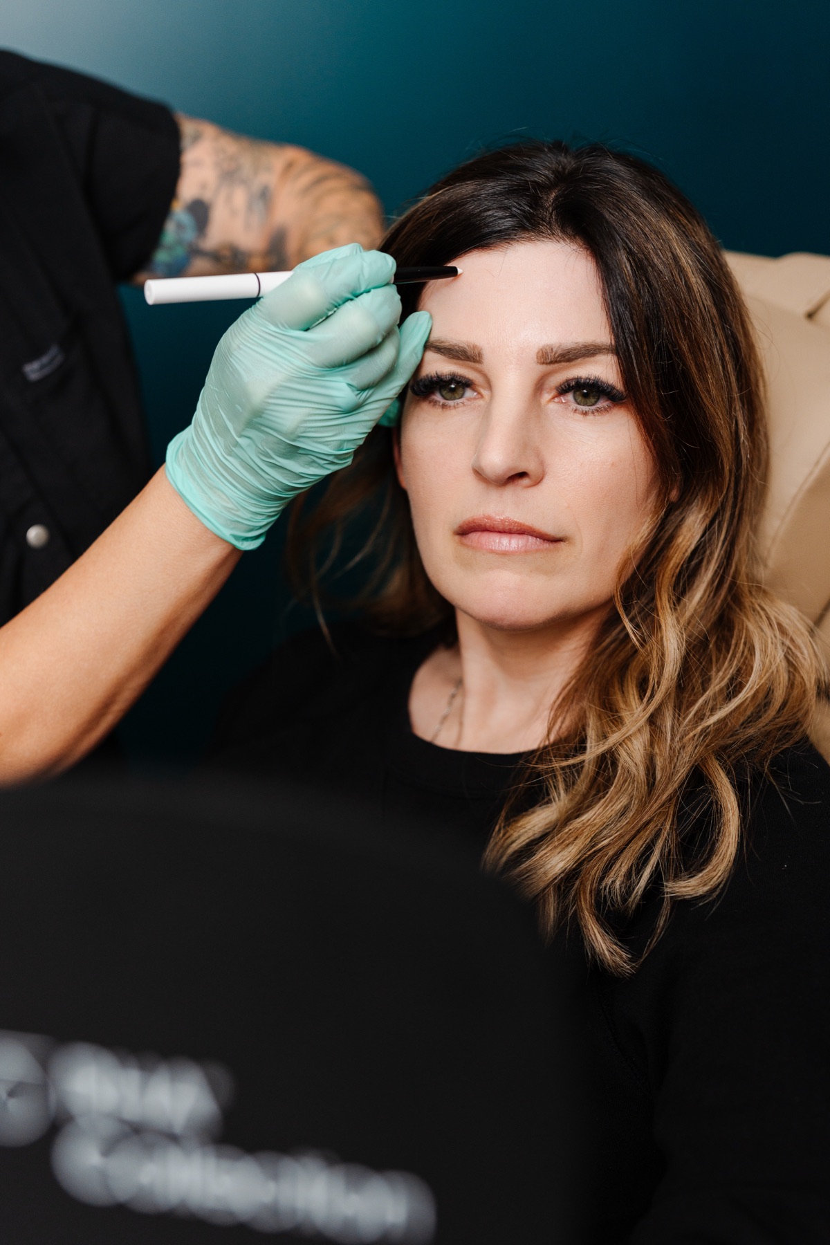 Microneedling pen on the forehead