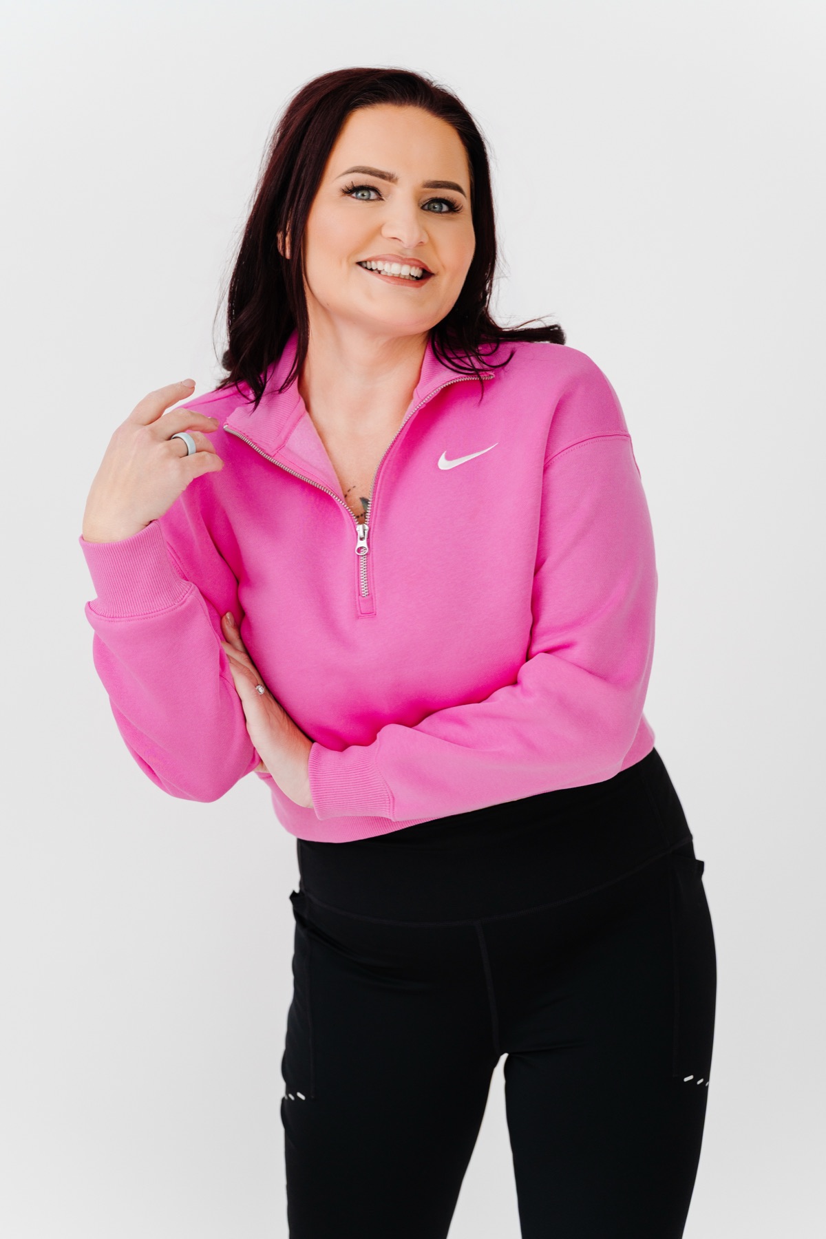 Sarah Sanchez in a pink sweatshirt, smiling