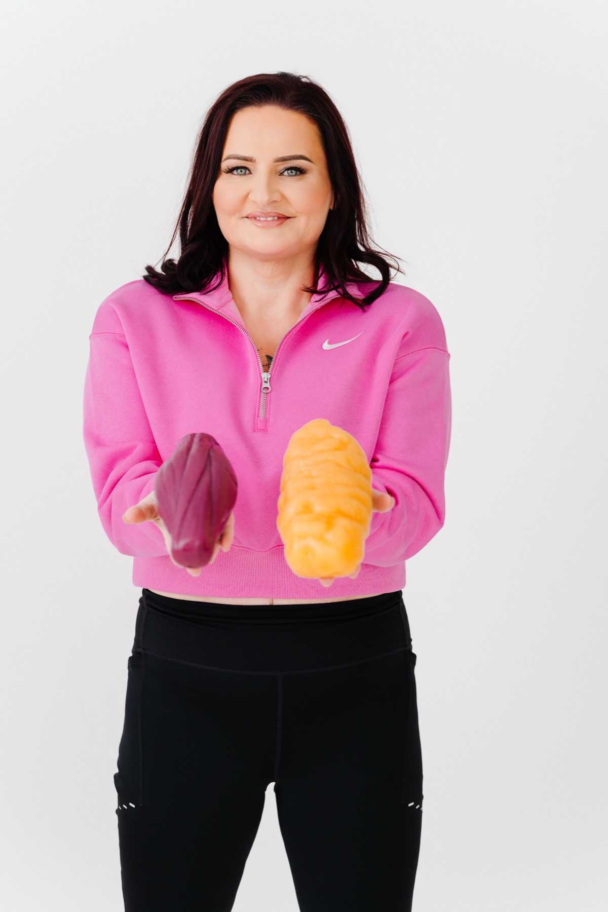 Sarah Sanchez holding fat and muscle models
