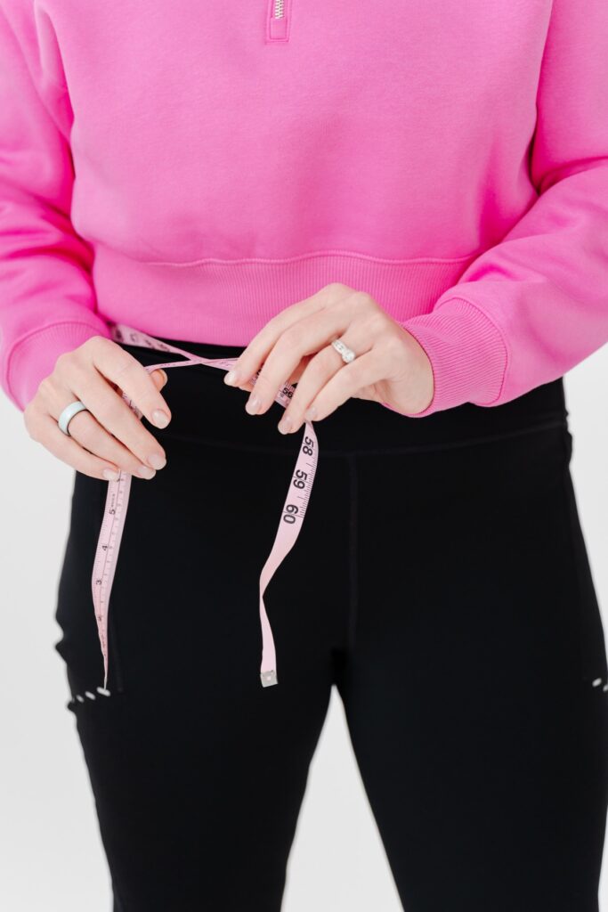Measuring tape around a waist