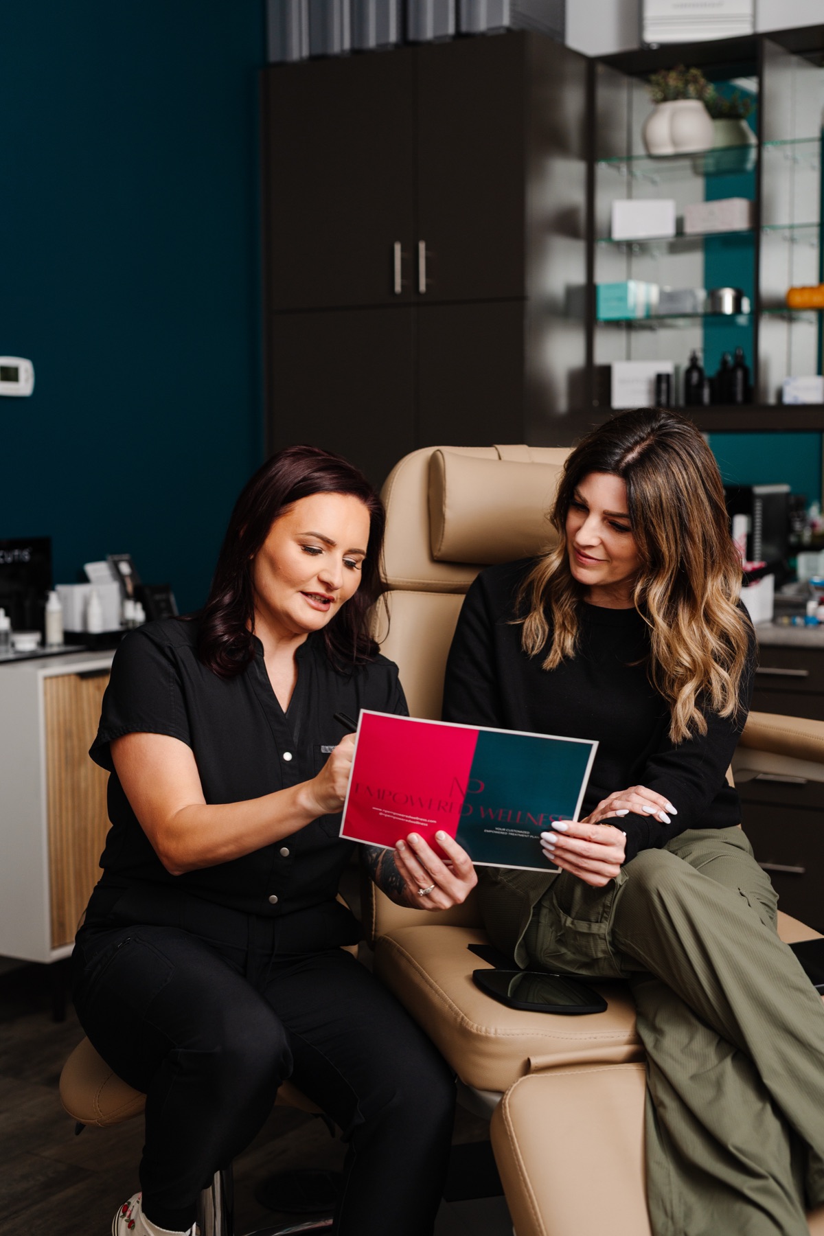 Sarah Sanchez going over a written treatment plan with a patient