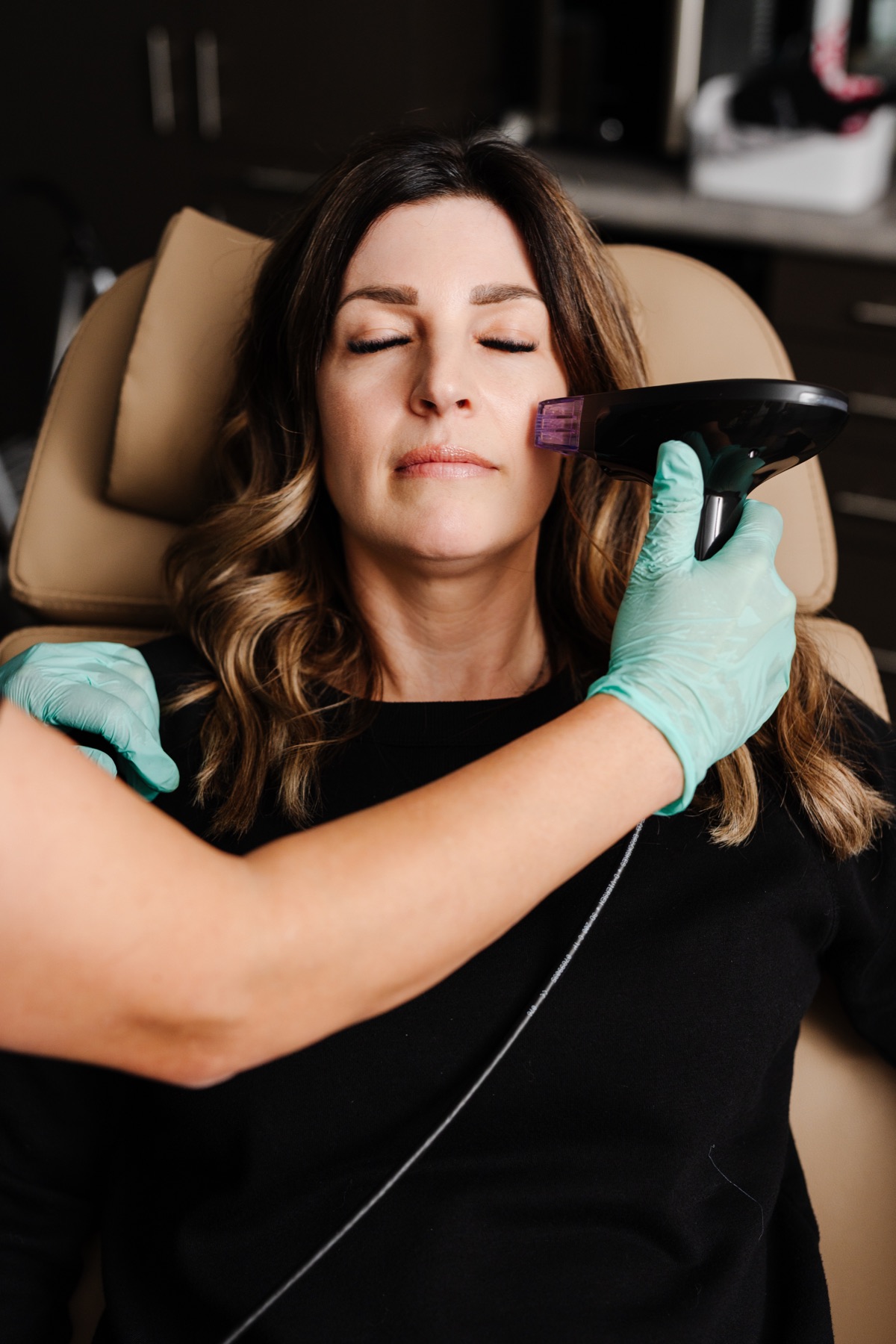 Patient relaxing during an energy-based skin treatment