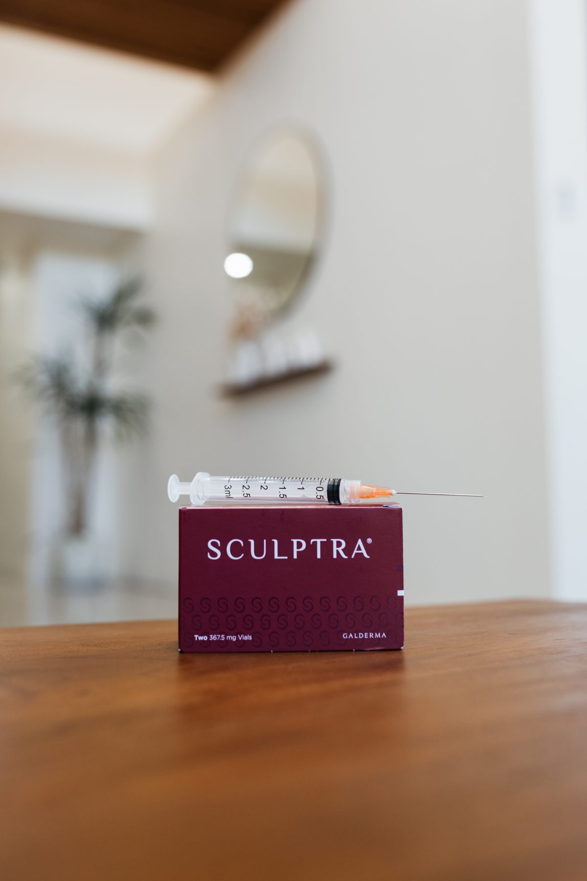 Sculptra box and syringe on a table in the clinic