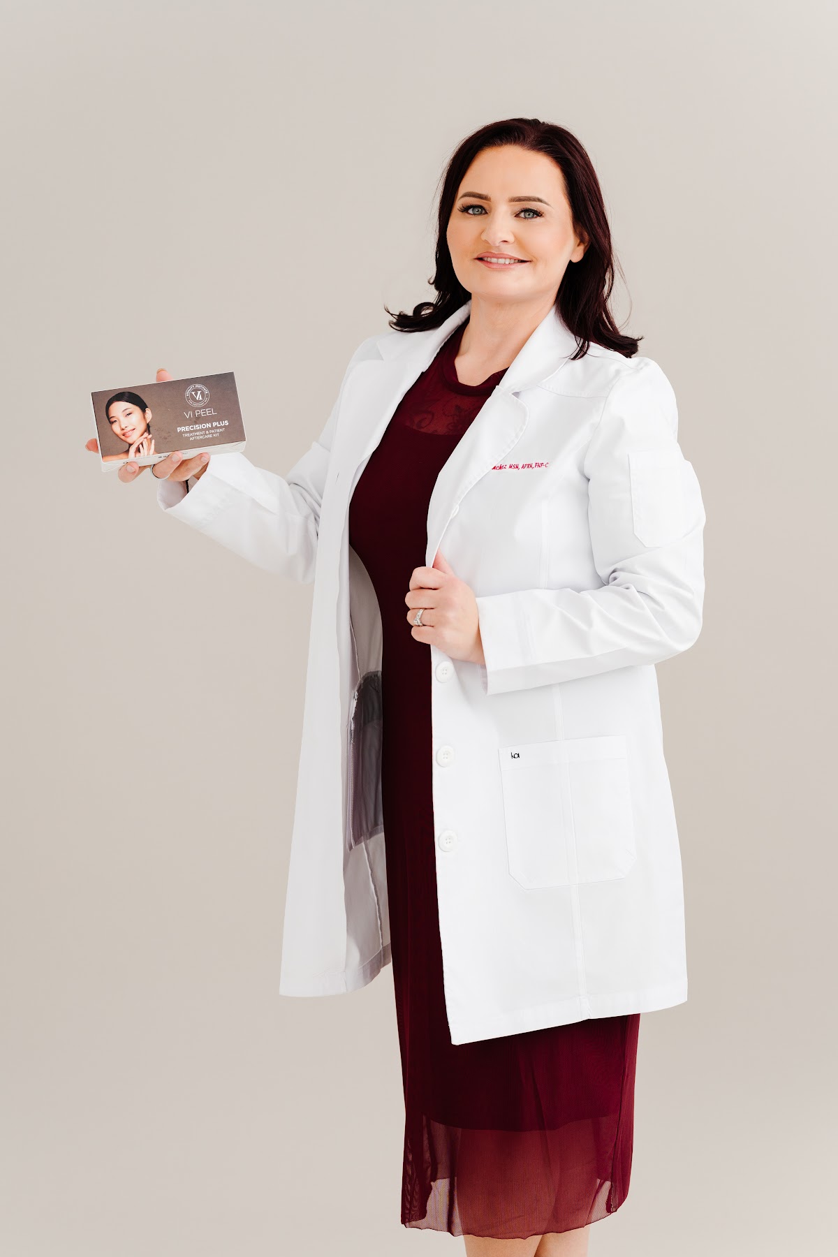 Sarah Sanchez holding a VI Peel Precision Plus box
